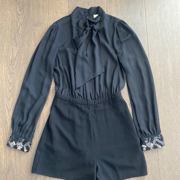 Long Sleeved Black Romper with Embellished Cuffs - Picture 2 of 6